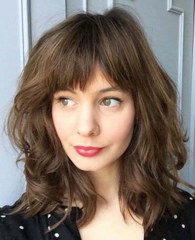 medium layered haircut with bangs