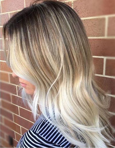 rooty blonde highlights and layered hair