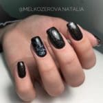 black-glitter-nails-with-marble-accent-marblenail