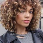 caramel-blonde-balayage-short-curly-hair