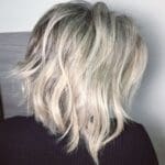 ash-blonde-choppy-bob-with-black-roots