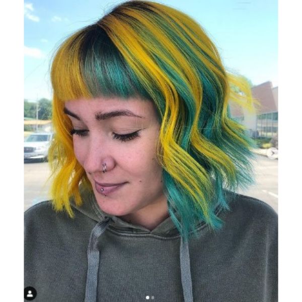 Yellow Teal Colored Curly Bob With Straight Bangs