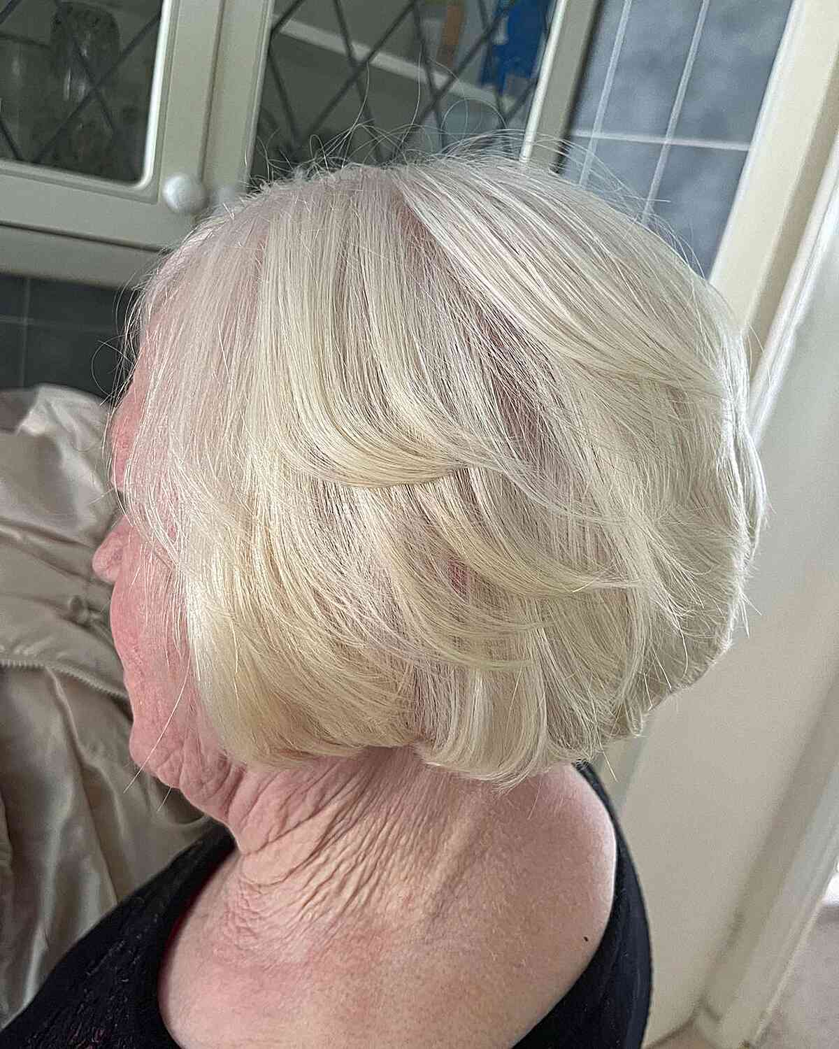 Short Butterfly Wispy White Bob on Older Women