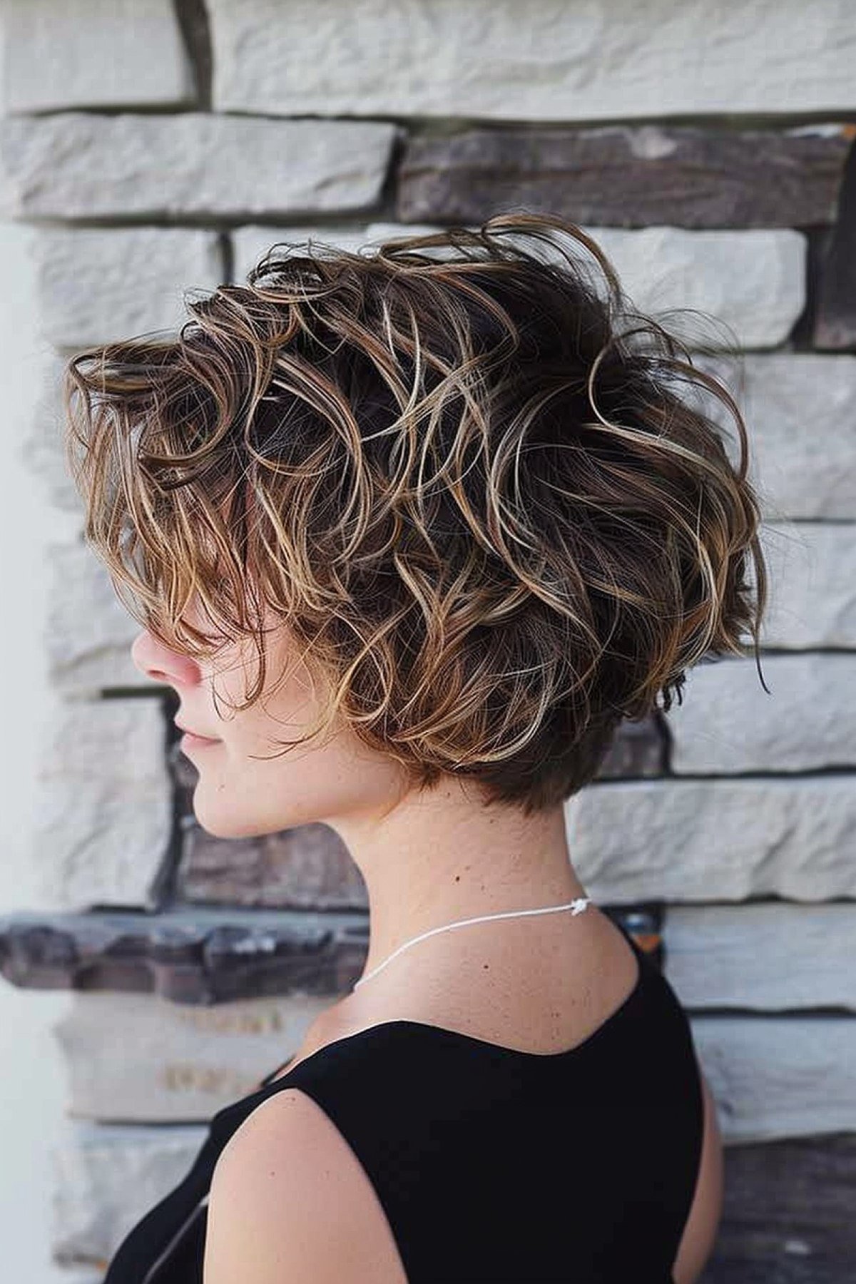 Short Wavy Layered Bob with Sun-Kissed Highlights