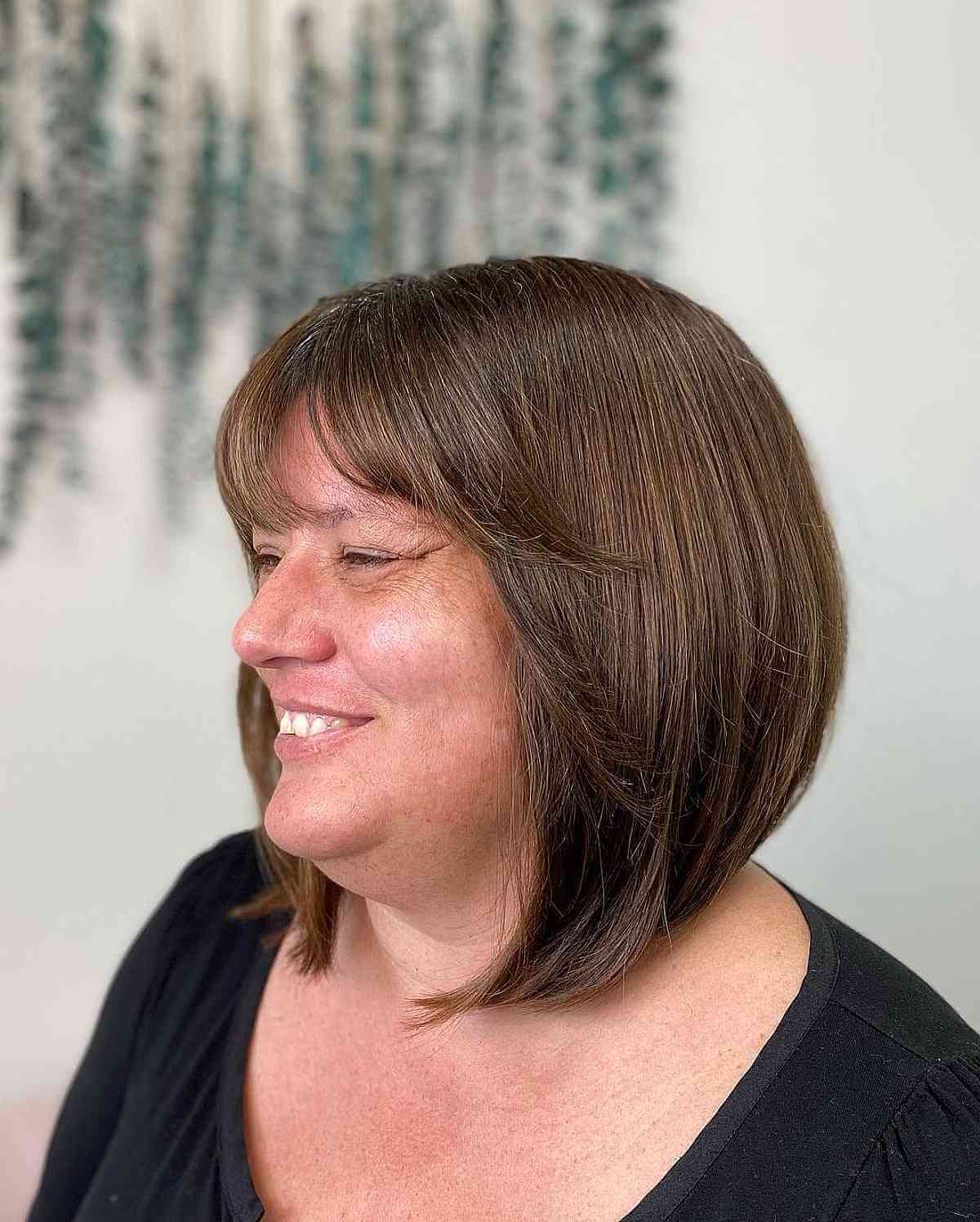 Angled Bob with Wispy Bangs for Women Over 40 with Fat Faces