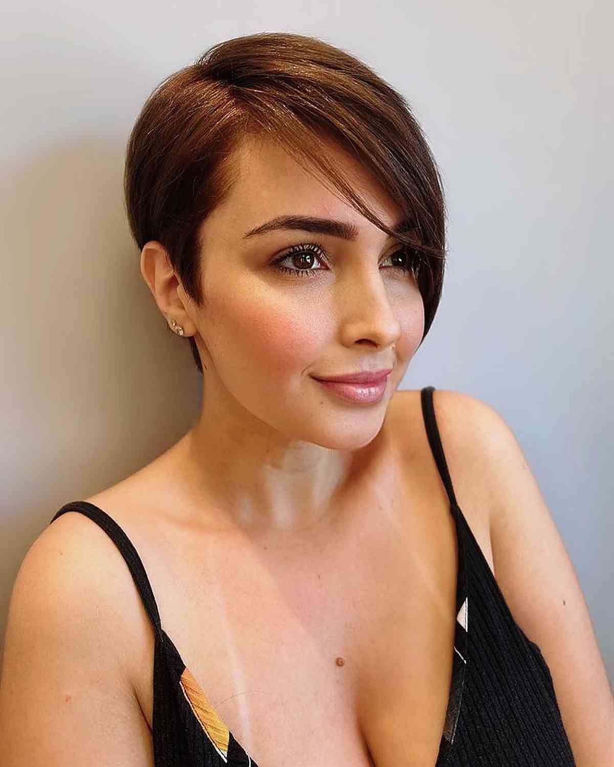 brunette side-swept long pixie cut