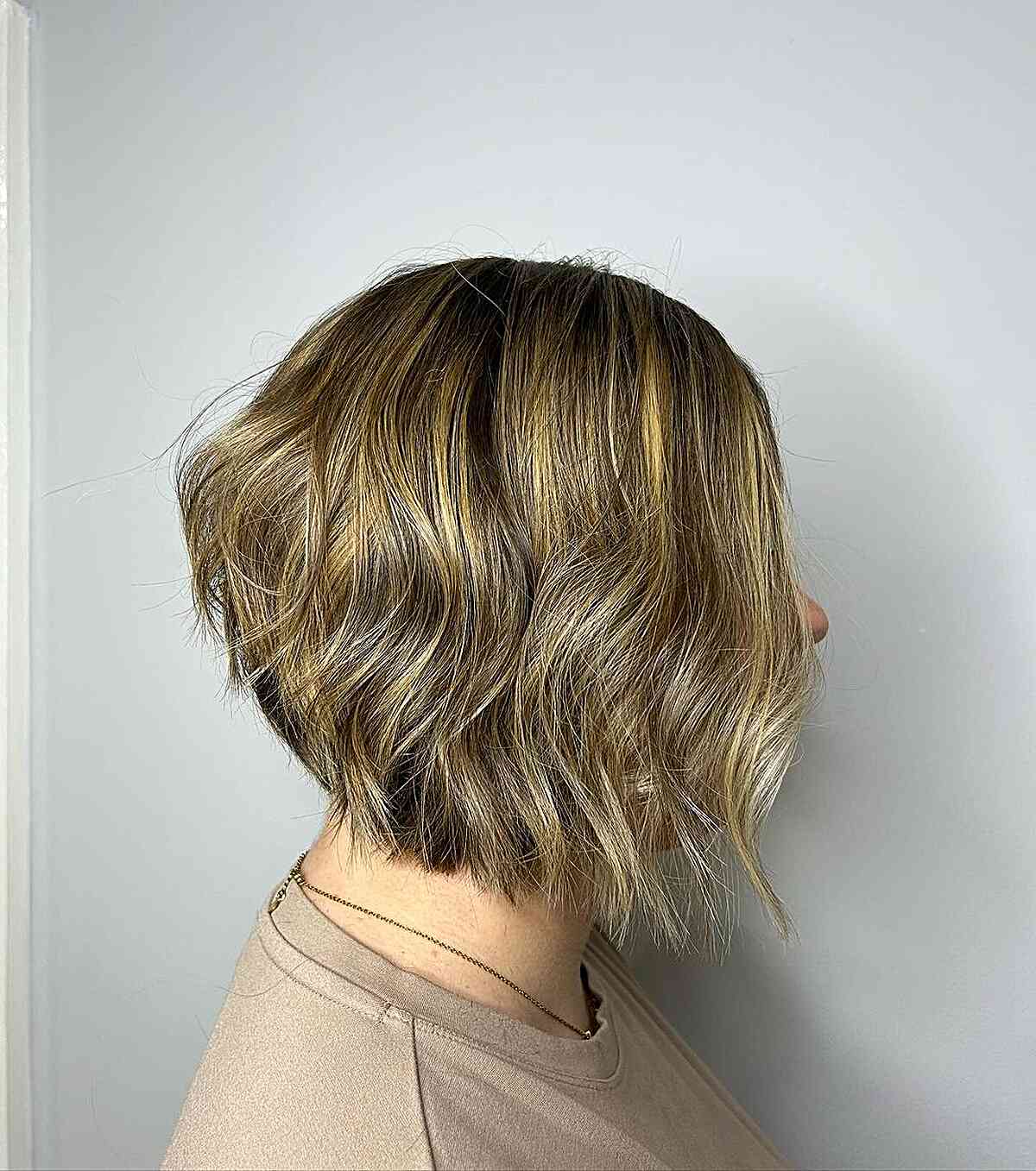 Chin-Grazing Stacked Choppy Bob with Blonde Balayage for Women