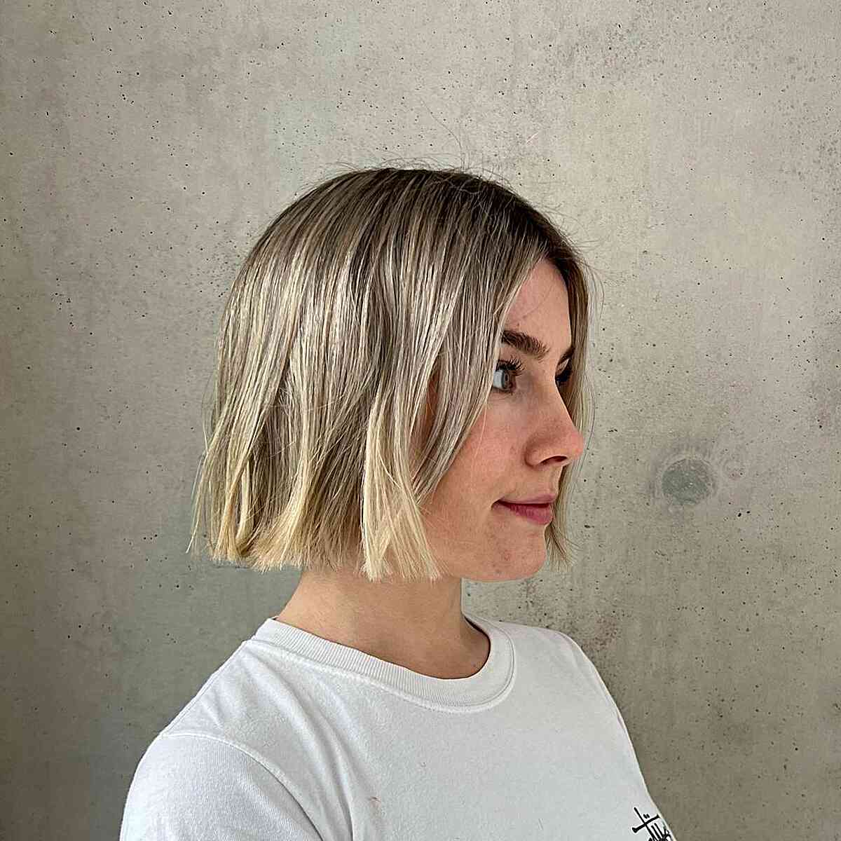 Chin-Length Sharp Boyfriend Bob Cut with Rooted Blonde Color