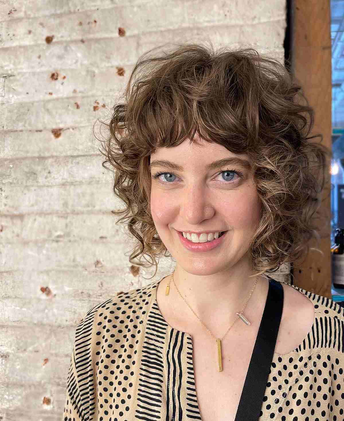 Cute Layered Curly Bob with Full Bangs