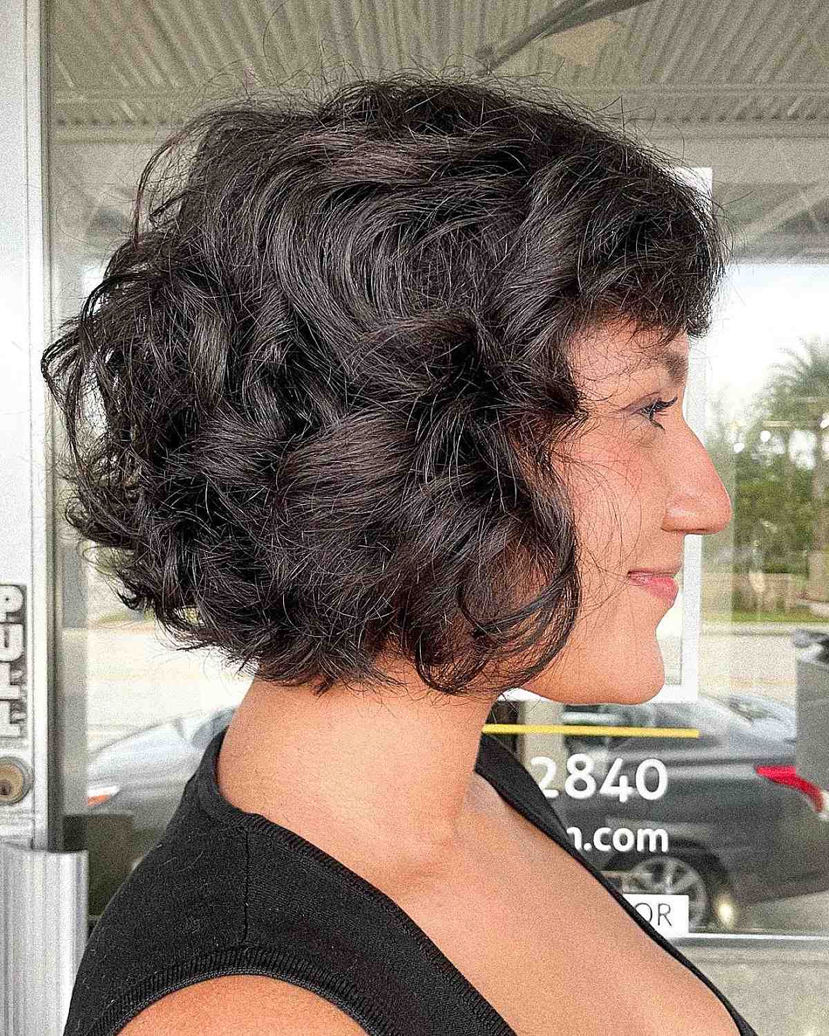 Cute shorter curly bob with bangs