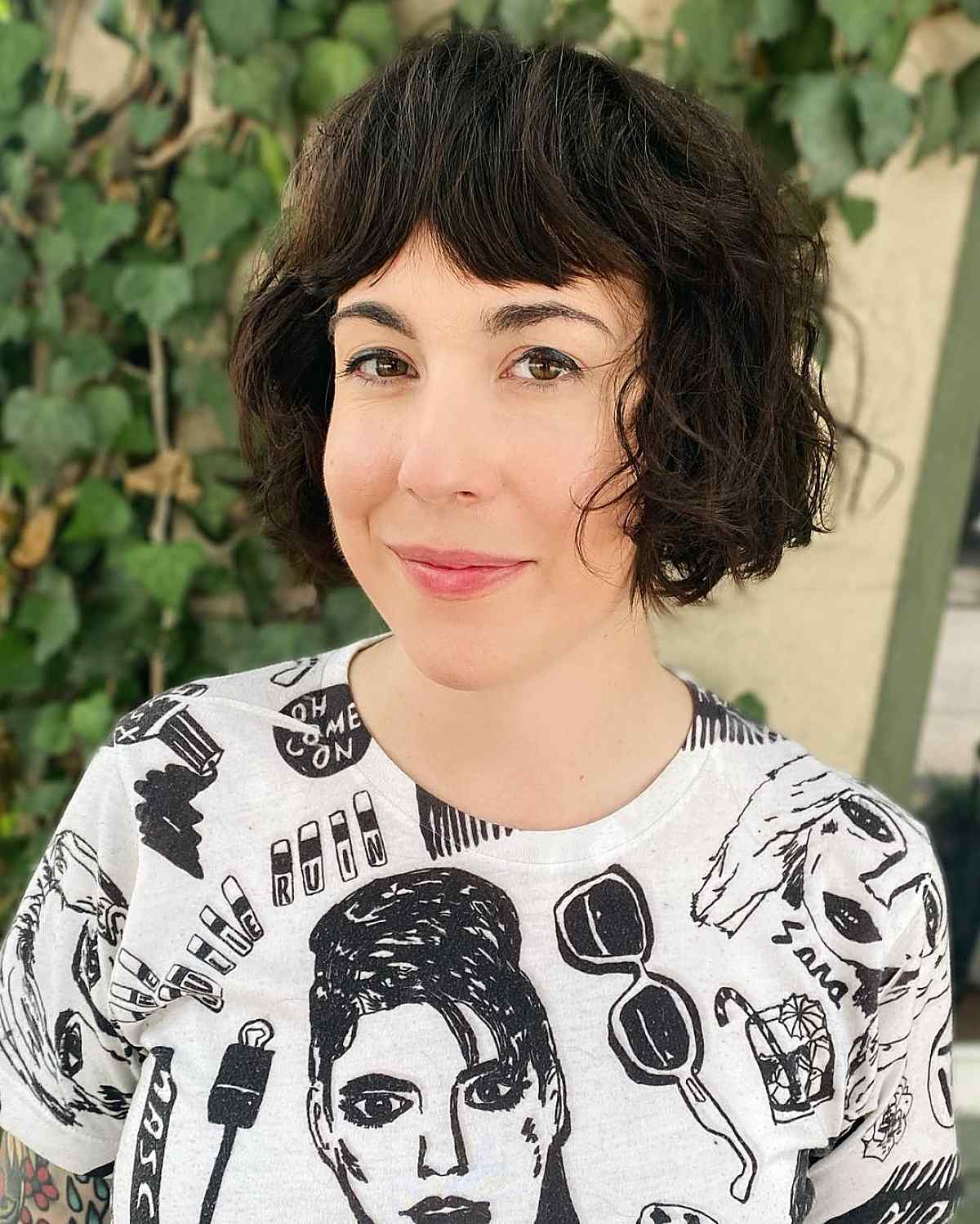 Feminine shaggy wavy bob with bangs