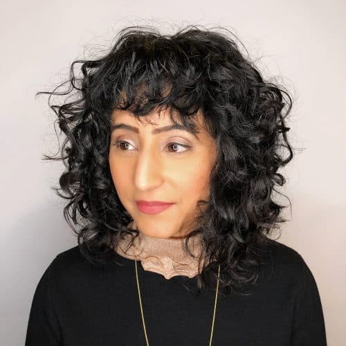 Gorgeous Layered Curly Bob with Bangs