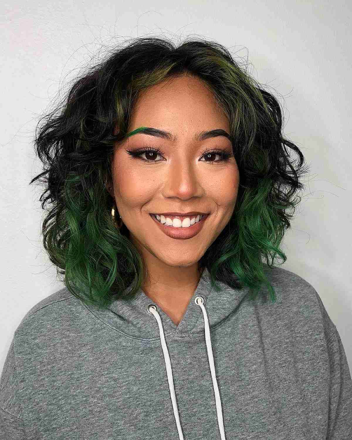 Layered Wavy Shaggy Bob on Dark Hair with Green Highlights