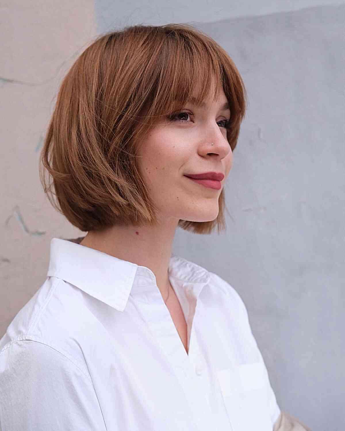 Light Brunette Bob with Choppy Layers and Bangs for women in their 30s with a chic style