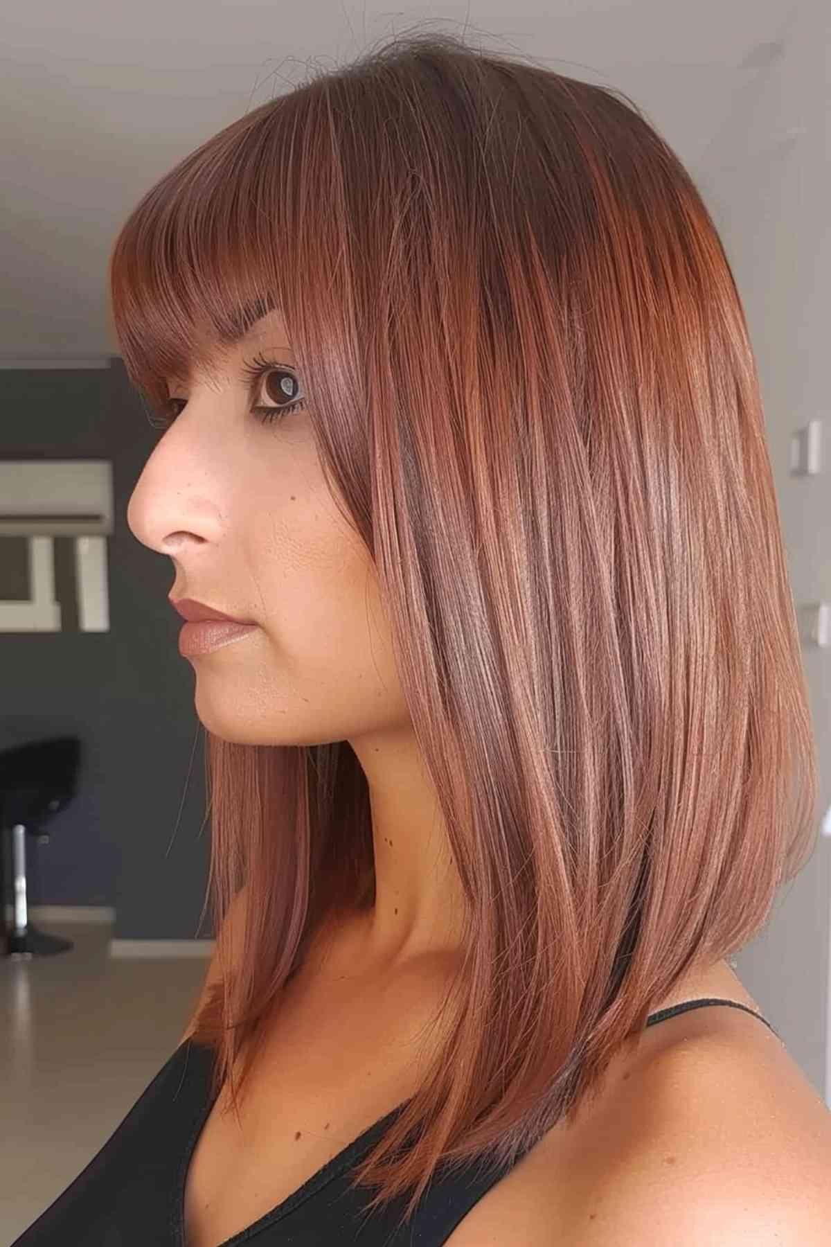 Medium-length graduated bob hairstyle with soft, straight lines and subtle layers. 