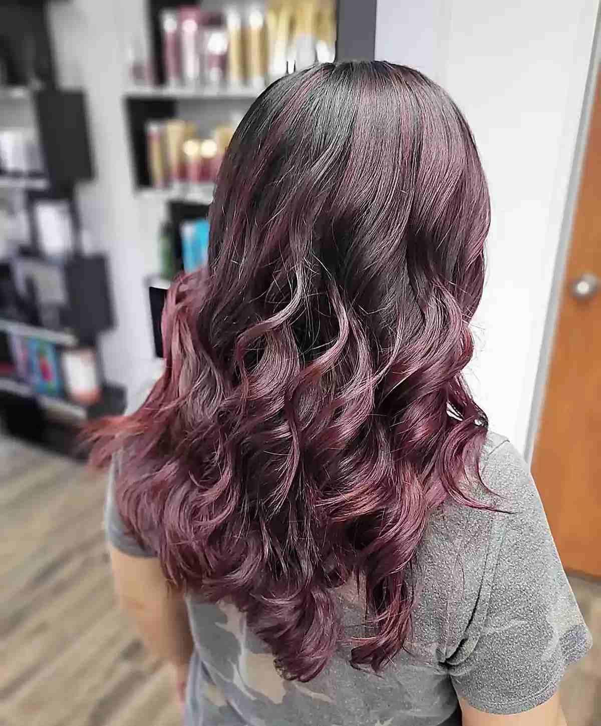 Muted Burgundy Balayage on Medium-Length Wavy Dark Hair