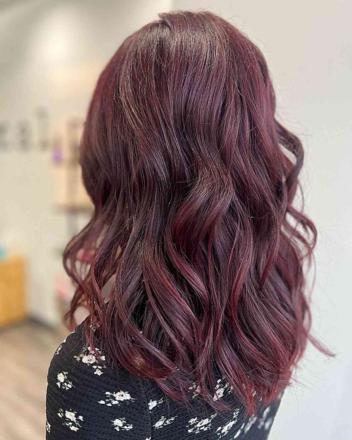 Muted Burgundy Red Hair with Soft Waves on Medium-Length Haircut