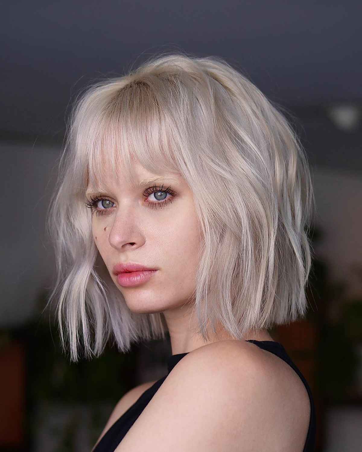 platinum blonde blunt cut with see-through bangs