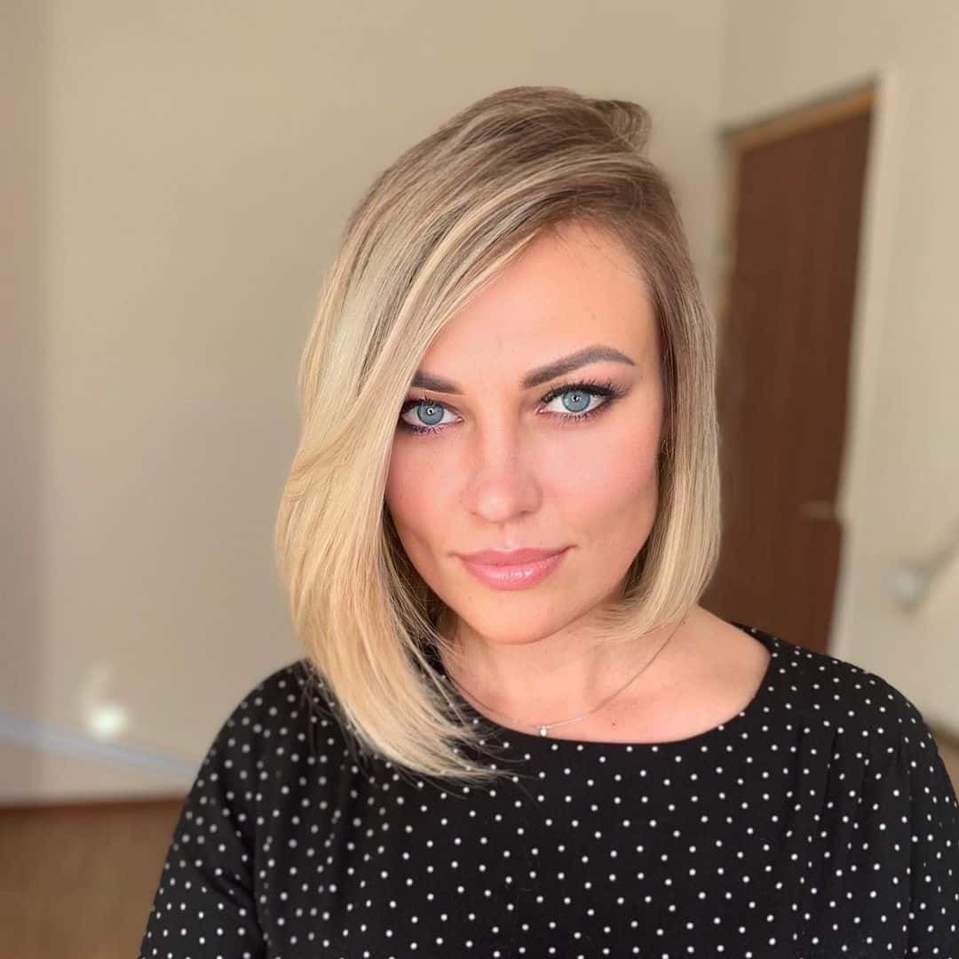 Short Blonde Asymmetrical Bob Haircut