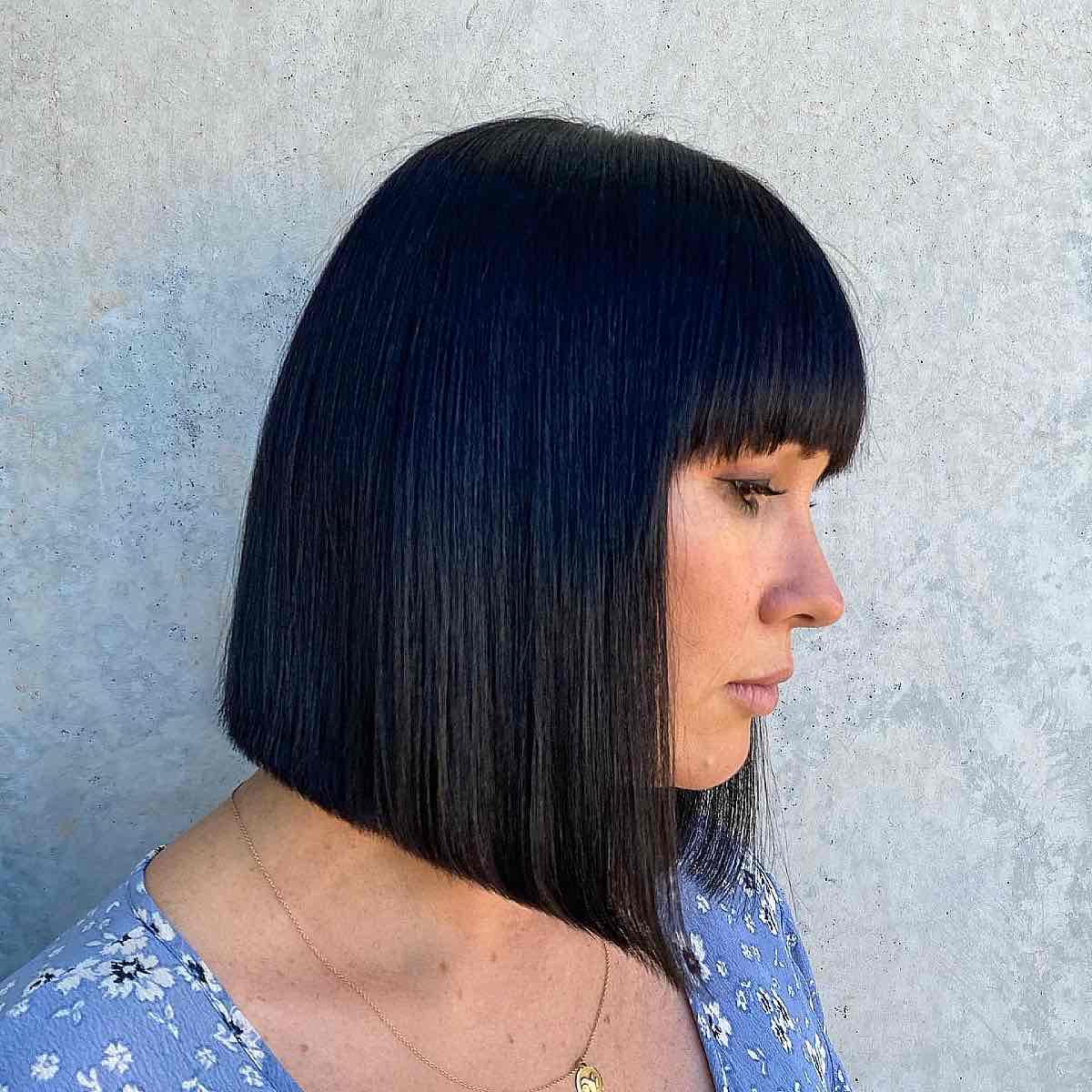 sleek black long blunt bob with bangs