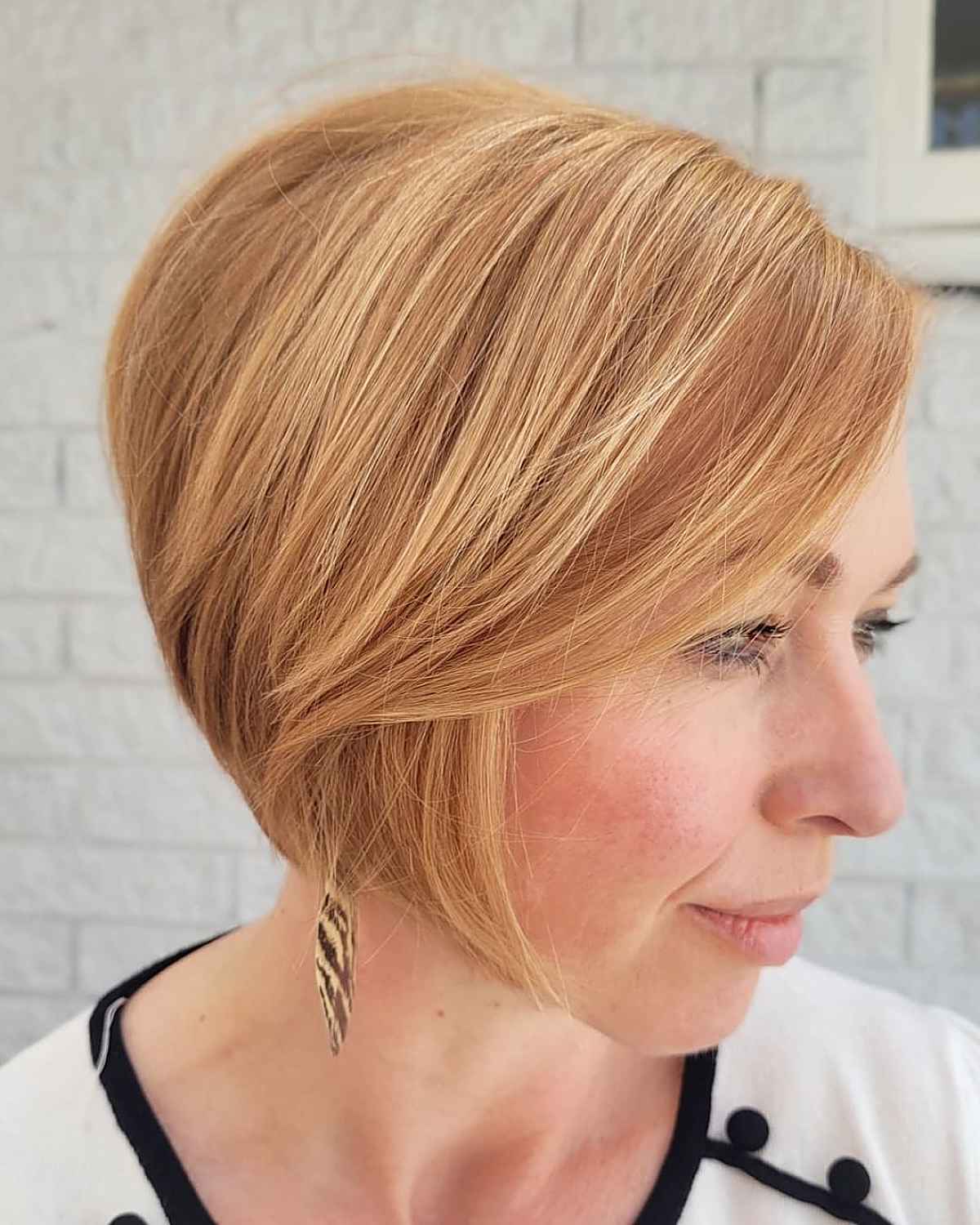 sleek bob with peach hair color