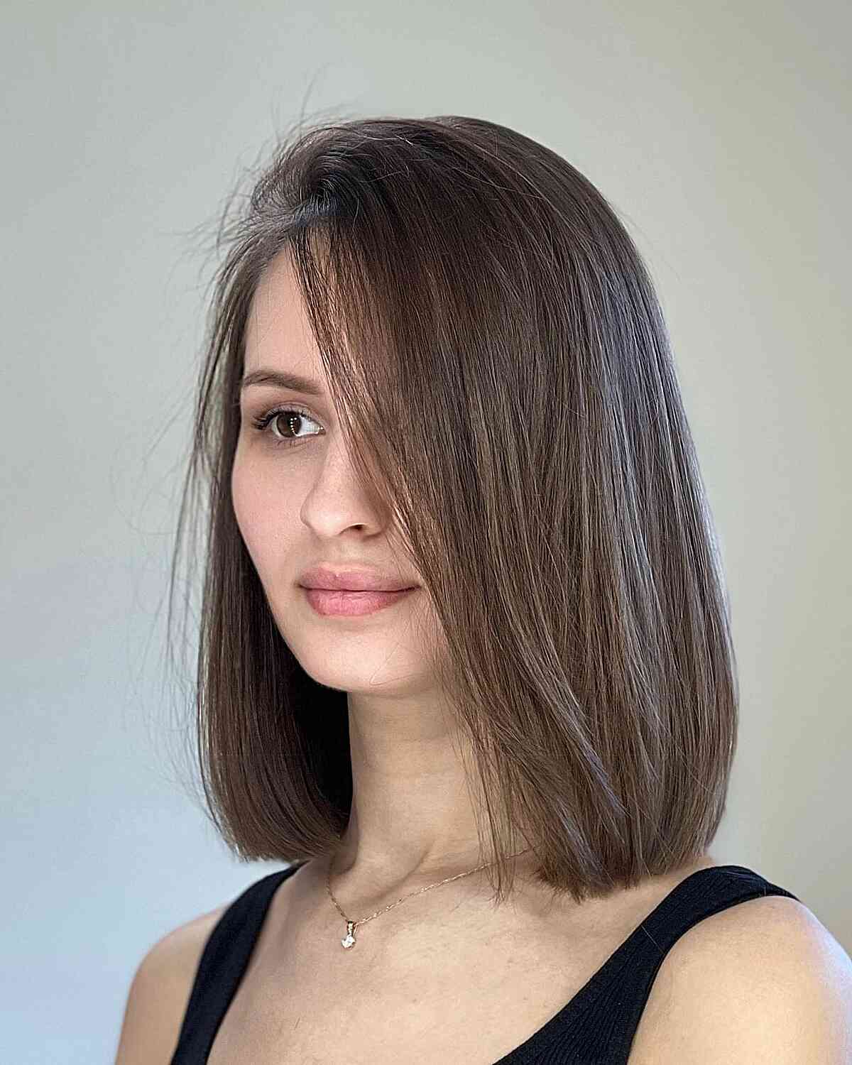 Straight lob with subtle layers and deep side part