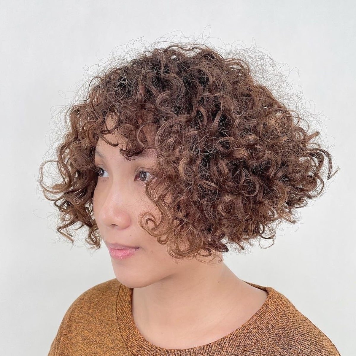 Sweet short curly inverted bob with fringe