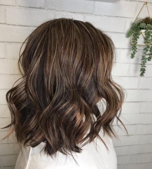 Trendsetting Wavy Brunette Bob Cut