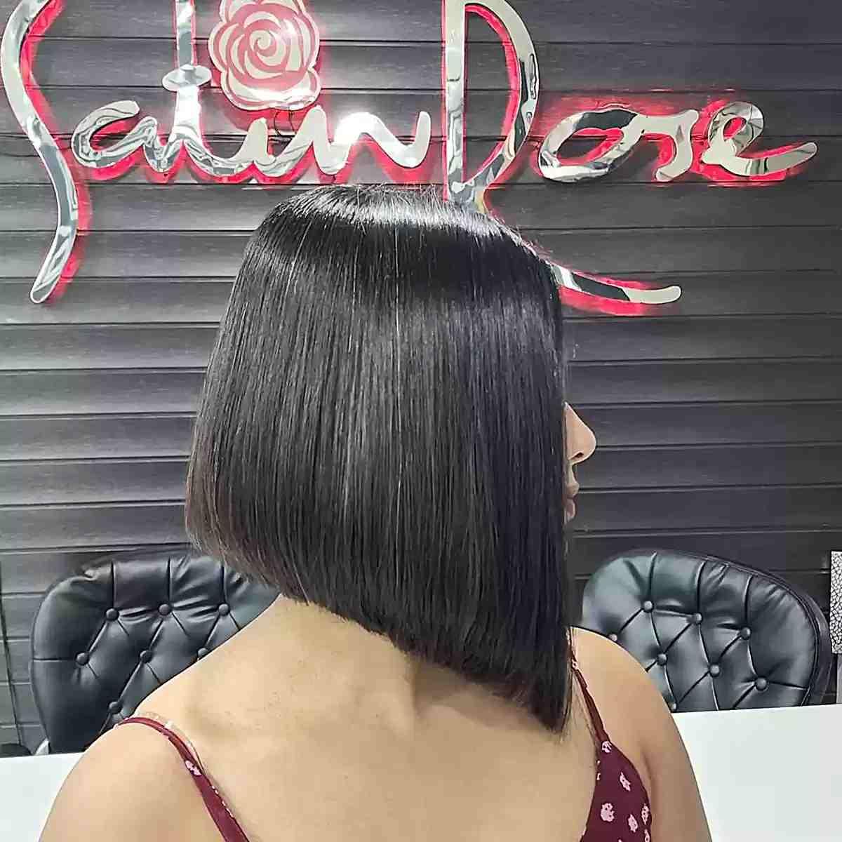 Woman with Mid-Length Precision A-Line Bob Haircut