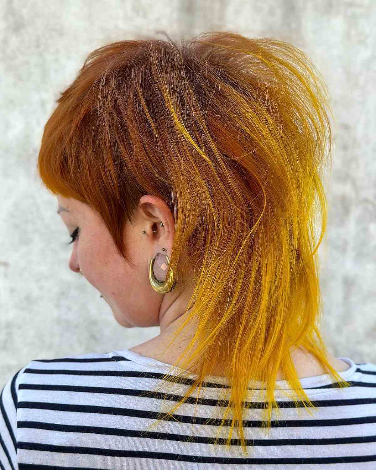 a mullet haircut with yellow ends