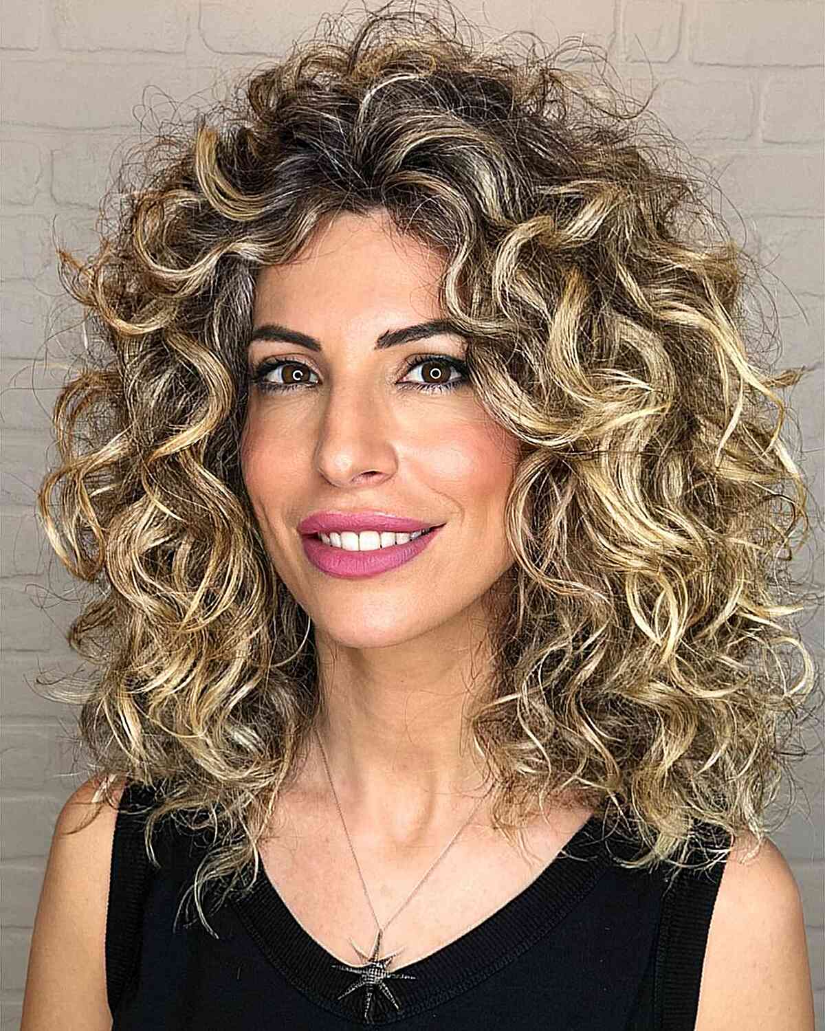 Beautiful Dirty Blonde Balayage for Curls