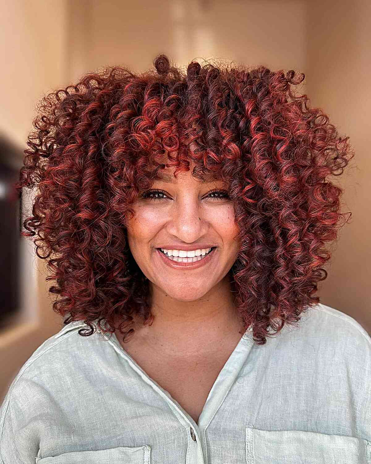 Classy & Sassy Red Balayage Curls with bright red hair dye for thick hair