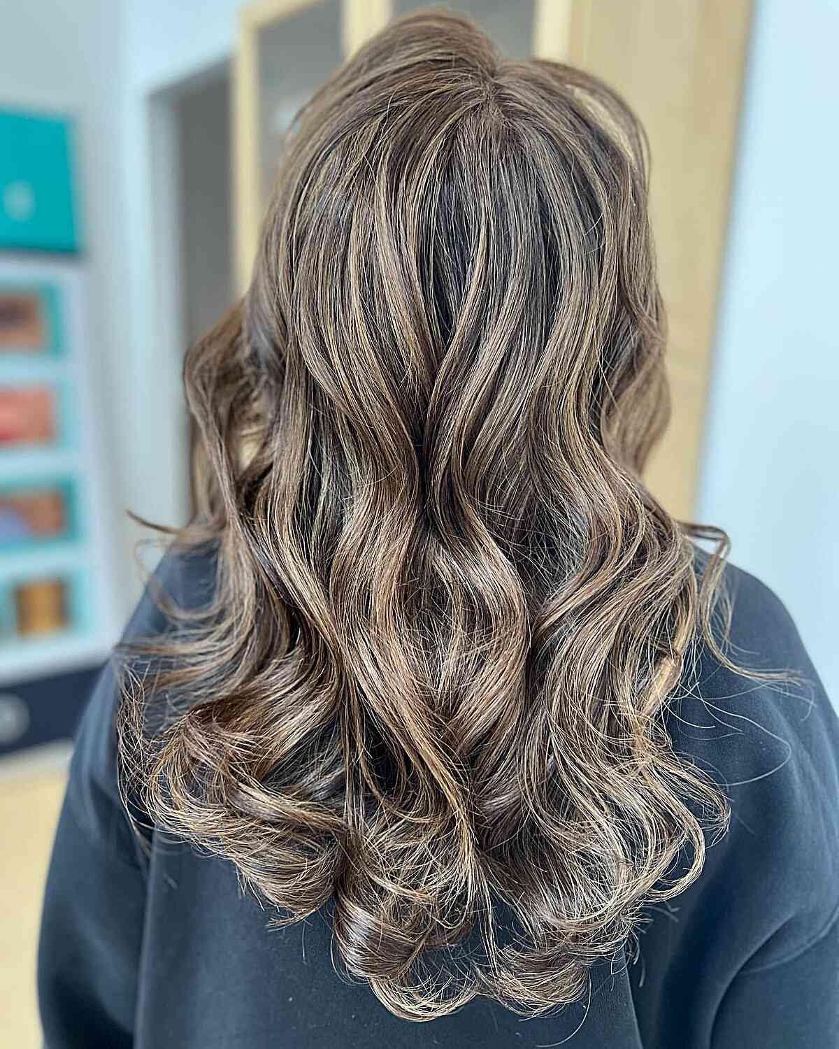 Dimensional Sun-Kissed Ash Brown Balayage Hair with Medium Cut