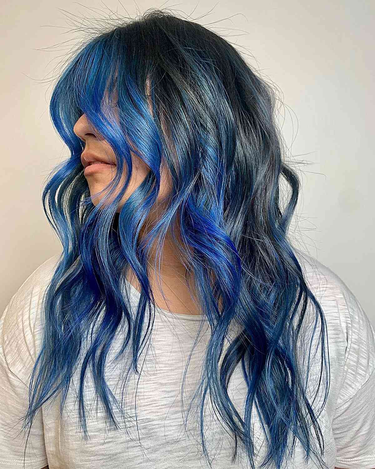 Face-Framing Electric Blue Balayage Highlights for Long Darker Locks