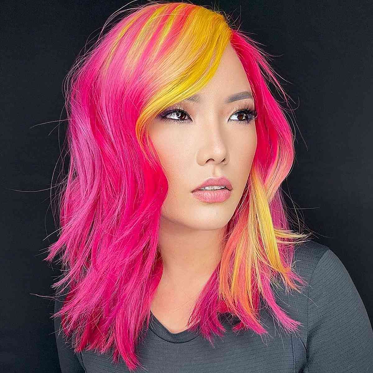 medium length pink hair with splashes of yellow color