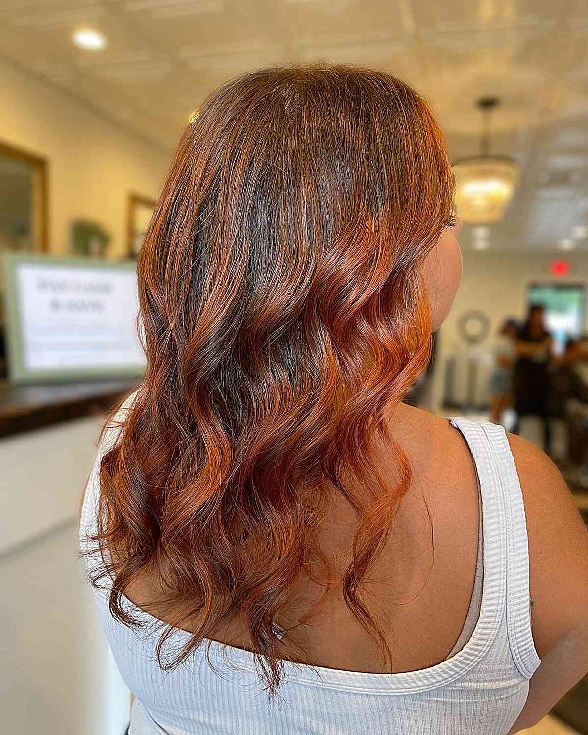 Pumpkin Spice Highlights on Mid-Length Dark Hair