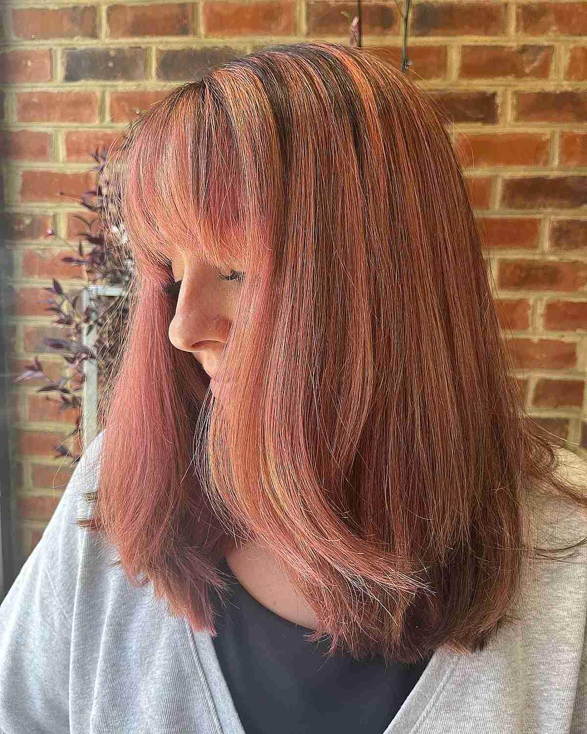 Rose Gold and Auburn Balayage Hair with Bangs