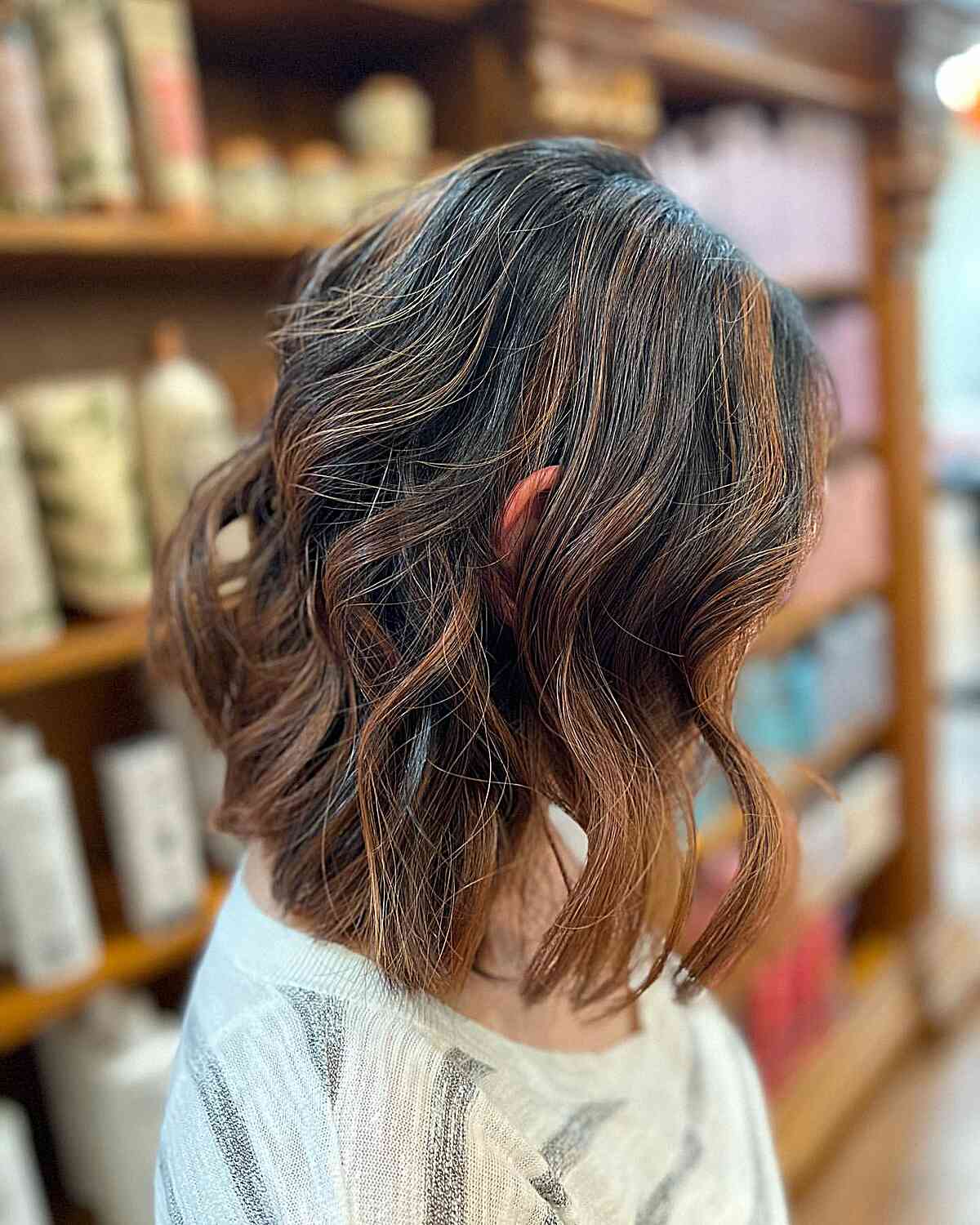 Short Chocolate Brown Balayage Bob with Warm Highlights