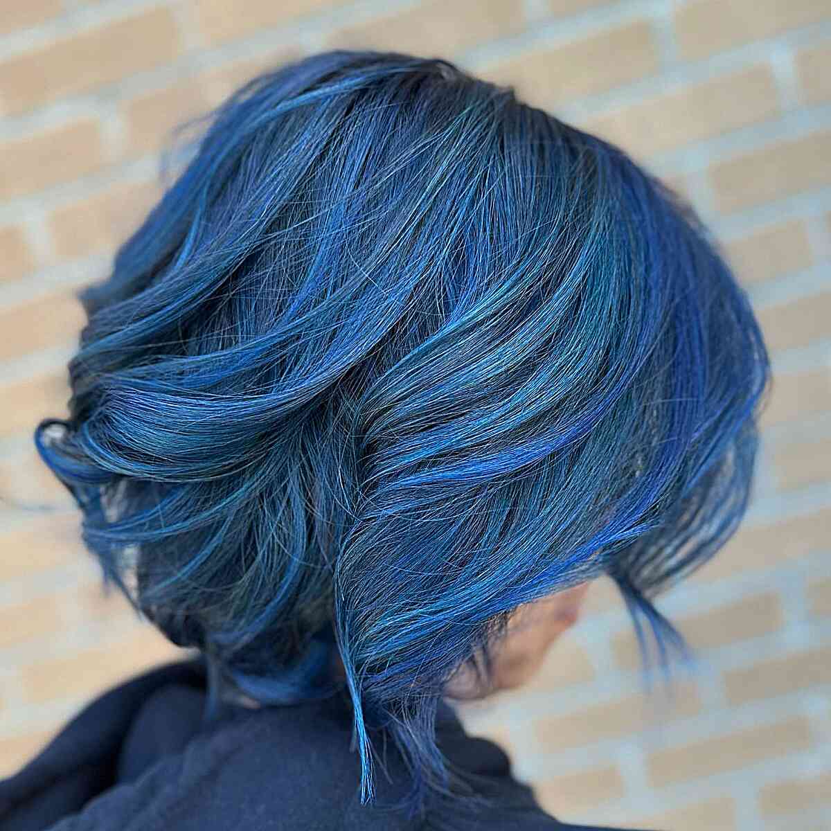 Short Dimensional Blue Balayage Bob with Voluminous Waves and Layers