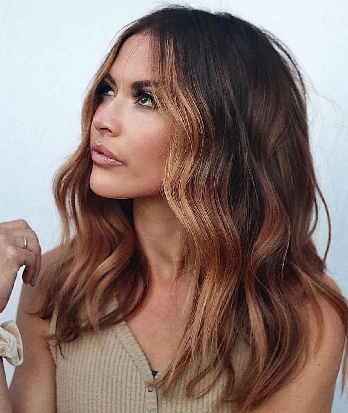 subtle face-framing balayage on dark hair