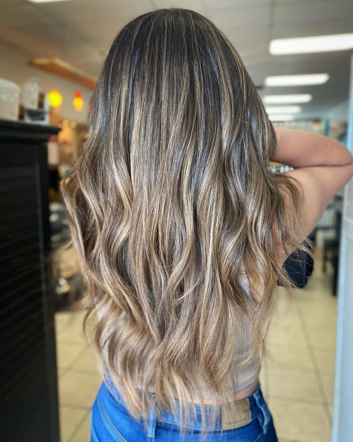 Bright honey blonde highlights on black hair