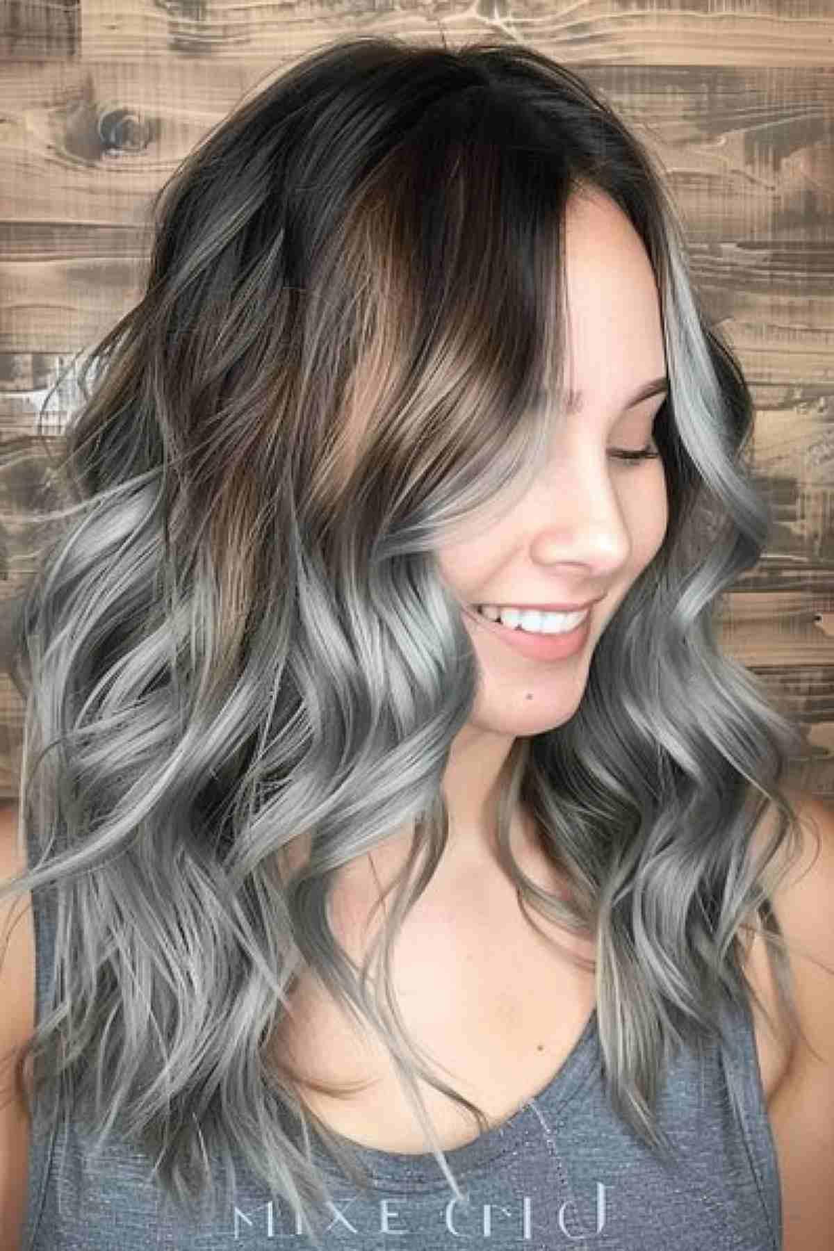 Grunge silver ombre hair on brunette base