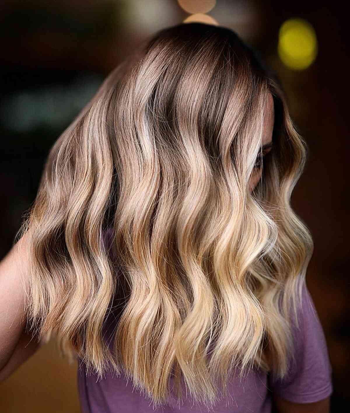 Hand-Painted Blonde Highlights on Brown Hair with loose waves