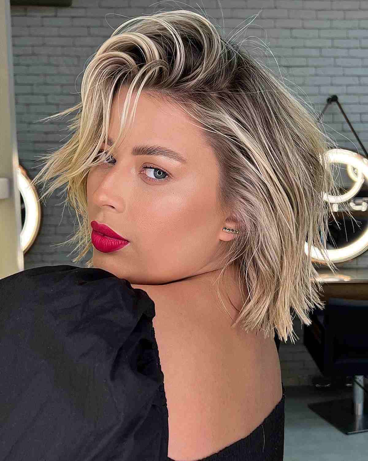 Light Blonde Highlights on Short Hair with a Deep Side Part