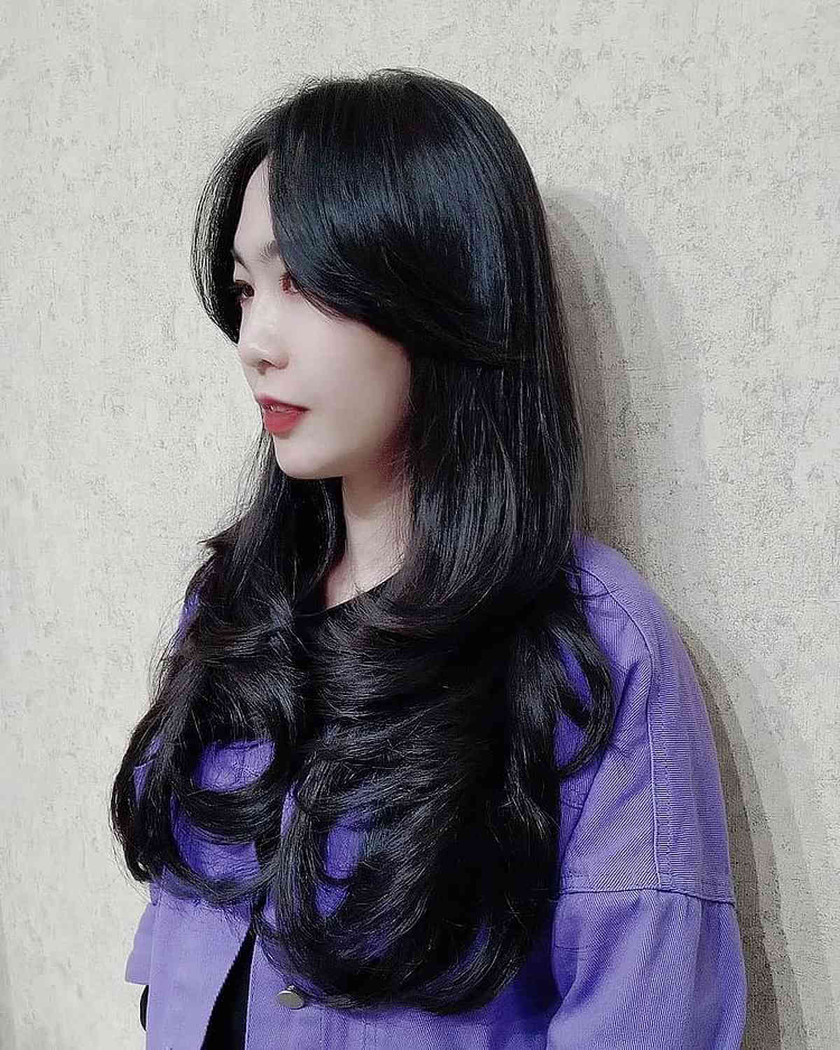 Long Layered Black Hair with Long Curtain Bangs