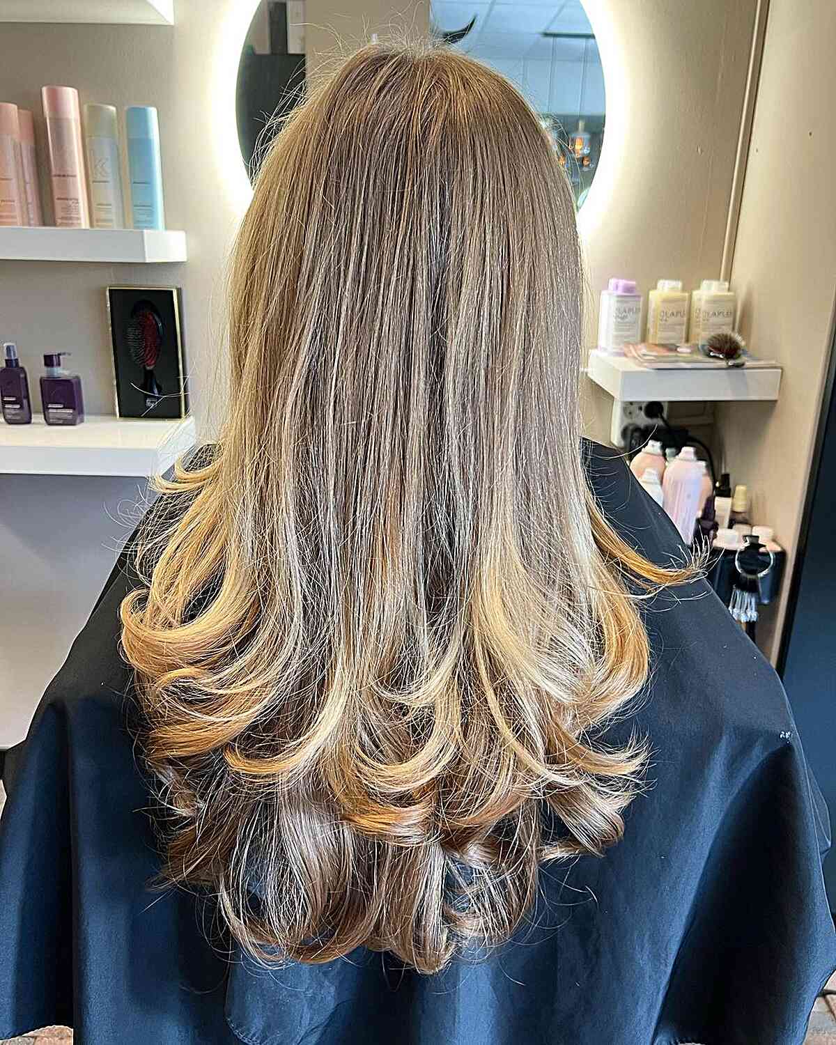 Long Two-Layer Butterfly Haircut with Blonde-Brown Color