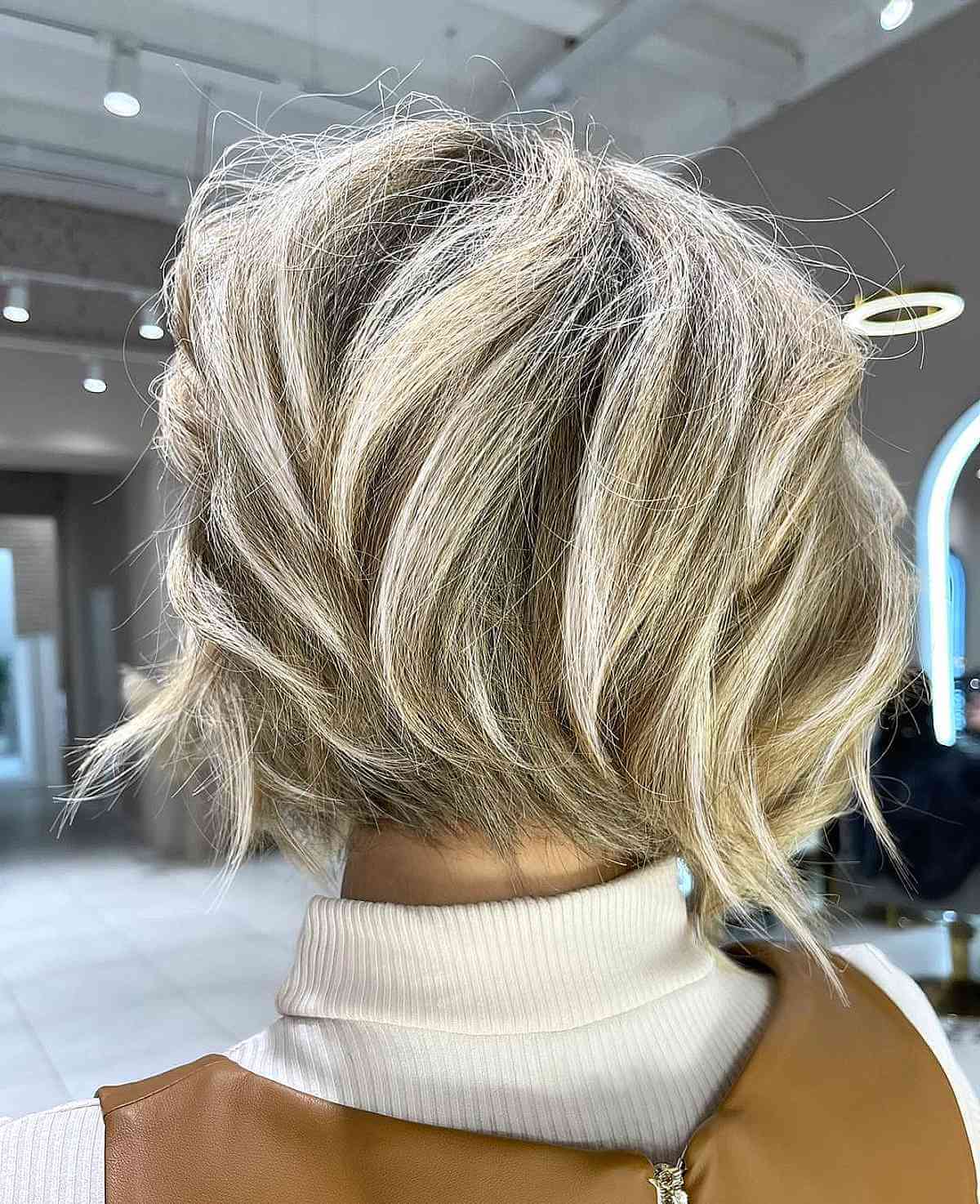 Messy Light Blonde Highlighted Stacked Bob Haircut