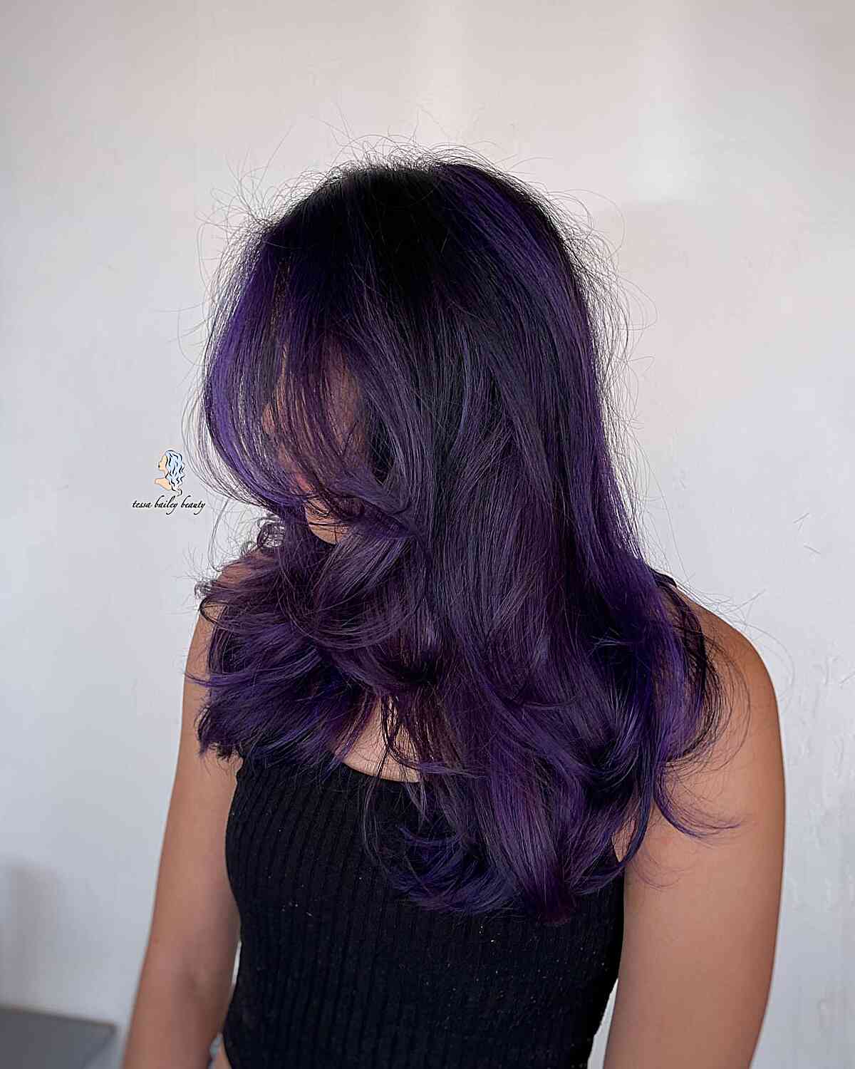 Midnight Purple Highlights and Medium-Length Voluminous Layers