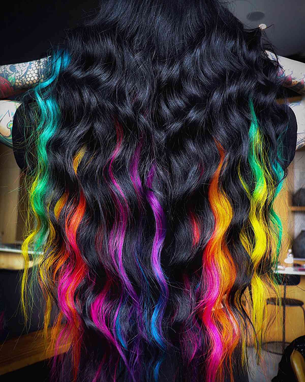 Rainbow Highlighted Black Hairstyle for long wavy hair