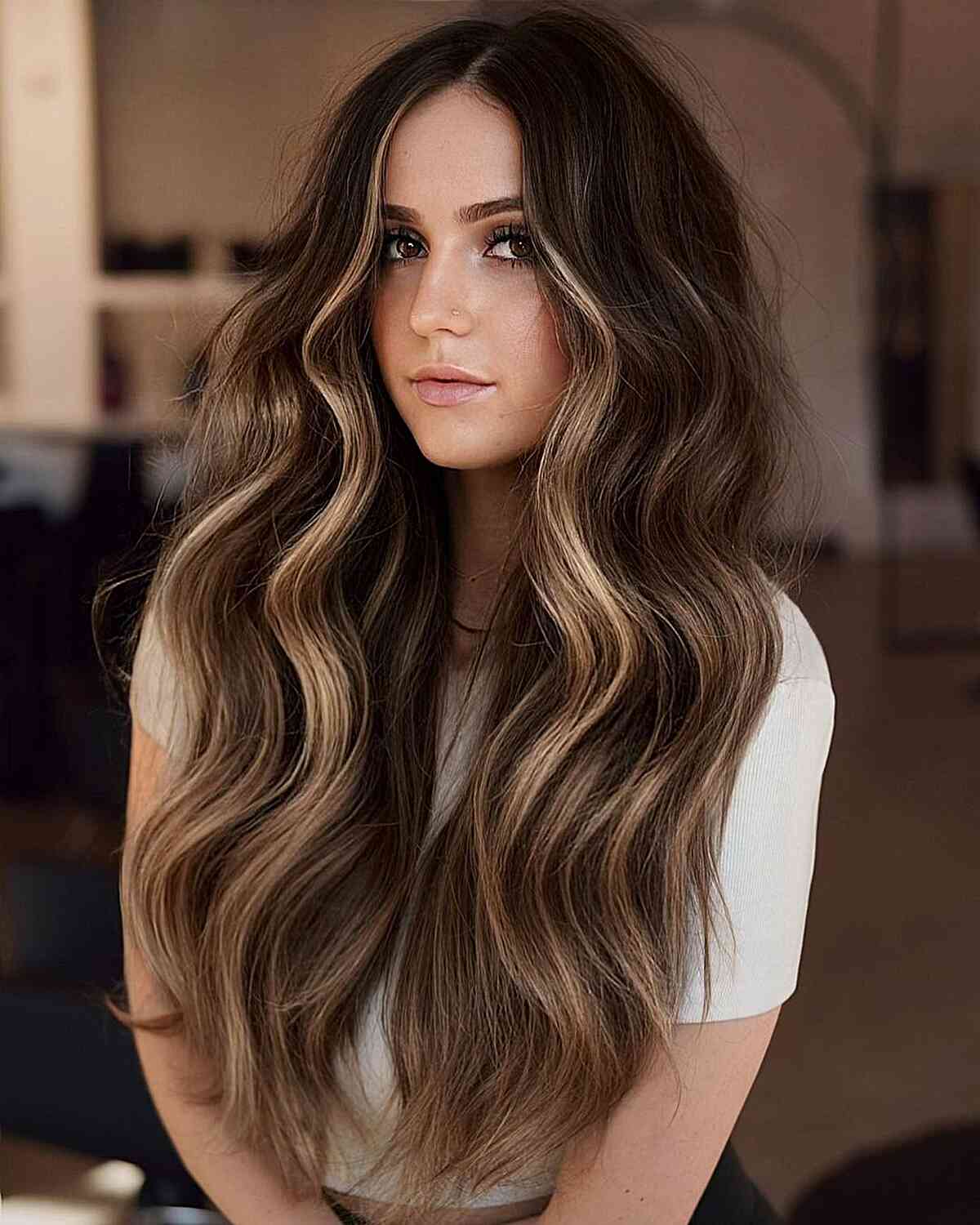 Sultry Long Dark Brown Balayage Hair with a Money Piece and Middle Part